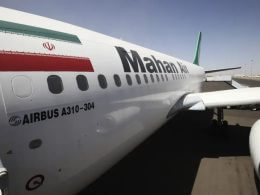 An Airbus A310 of Iranian private airline Mahan Air is seen at Sanaa International airport following its first flight to Yemen from Iran, in Sanaa March 1, 2015. (credit: REUTERS/MOHAMED AL-SAYAGHI)
