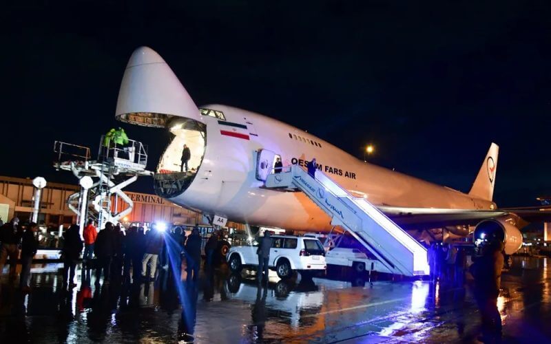 A handout picture released by the official Syrian Arab News Agency (SANA) shows an Iranian plane on the tarmac at Damascus airport delivering rescue aid. AFP