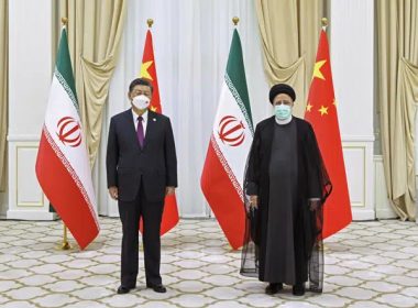 In this file photo released by China's Xinhua News Agency, Iran's President Ebrahim Raisi, right, and Chinese President Xi Jinping pose for a photo on the sidelines of a meeting at the Shanghai Cooperation Organization (SCO) summit in Samarkand, Uzbekistan on Sept. 16, 2022.