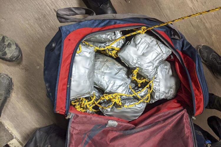 This undated photo provided by U.S. Customs and Border Protection shows some of over 165 pounds (75 kilograms) of suspected methamphetamine seized after smugglers tried to float it across the border from Nogales, Mexico, by roping together dozens of packages and sending them through an underground drainage tunnel into Arizona, according to federal officials. HOGP / AP