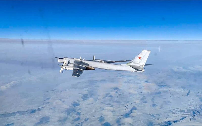 In this handout photo taken from video released by Russian Defense Ministry Press Service on Tuesday, Feb. 14, 2023, A Tu-95 strategic bomber of the Russian air force is seen from another one during their mission. (AP)