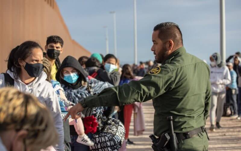 Illegal immigrants' families are taken into custody by U.S. Border Patrol agents at the U.S.–Mexico border in Yuma, Ariz., on Dec. 7, 2021. (John Moore/Getty Images)