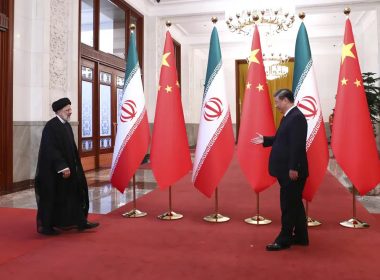 In this photo released by the official website of the office of the Iranian Presidency, President Ebrahim Raisi, left, arrives in an official welcoming ceremony by his Chinese counterpart Xi Jinping in Beijing, Tuesday, Feb. 14, 2023. (Iranian Presidency Office via AP)