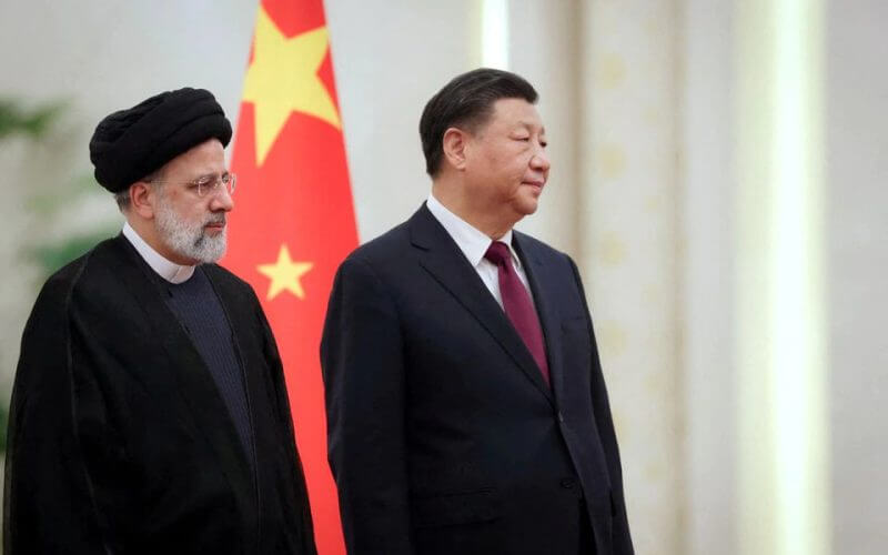 Iranian President Ebrahim Raisi stands next to Chinese President Xi Jinping during a welcoming ceremony in Beijing, China, February 14, 2023. Iran's President Website/WANA (West Asia News Agency)/Handout via REUTERS