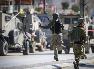 Israeli security forces secure the scene of a shooting attack where two Israelis were killed in Hawara, in the West Bank, near Nablus, February 26, 2023. (Nasser Ishtayeh/Flash90)