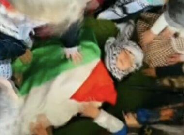 Screen capture from a video published by the Al-Tofula Kindergarten in Beit Awwa in the West Bank, showing children simulating a ‘martyr’ funeral for one of their number who is killed in a pretend clash with the IDF, February 14, 2023. Twitter