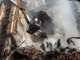 Firefighters search for survivors after a drone attack on buildings in Kyiv, Ukraine, on Oct. 17, 2022. ASSOCIATED PRESS