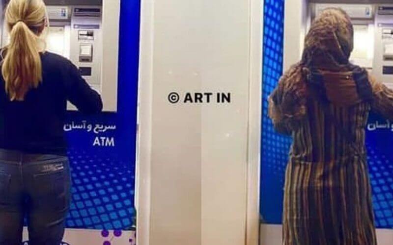 Two Iranian women at the ATM in Tehran. iranintl.com