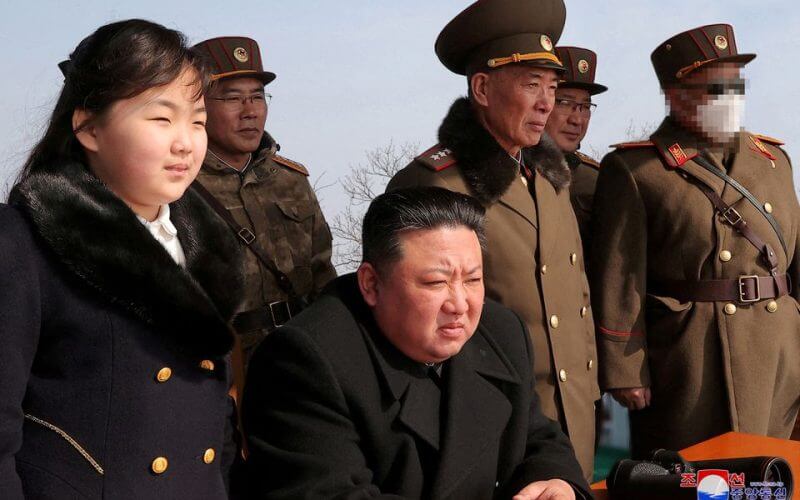North Korean leader Kim Jong Un and his daughter Kim Ju Ae watch a missile drill at an undisclosed location in this image released by North Korea's Central News Agency (KCNA) on March 20, 2023. KCNA via REUTERS