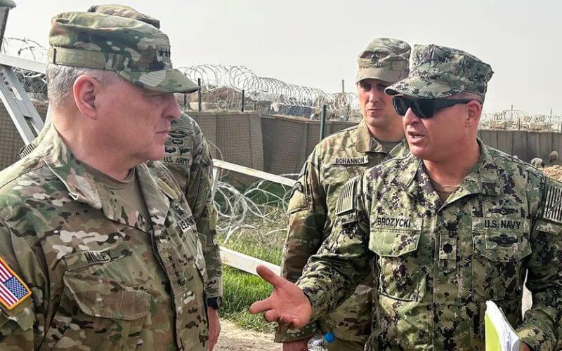 U.S. Joint Chiefs Chair Army General Mark Milley, left, speaks with U.S. forces in Syria during an unannounced visit, at a U.S. military base in Northeast Syria, March 4, 2023. (REUTERS/Phil Stewart/File Photo)