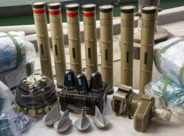 In this photo from the U.S. Army, anti-tank missiles and medium-range ballistic missile components seized by the United Kingdom Royal Navy sit pier side at an undisclosed location in the Middle East on Feb. 26, 2023. AP