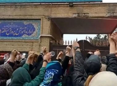 This grab taken from a UGC video made available on the ESN platform on March 4, 2023, shows families gathering and chanting slogans outside an education ministry building in Tehran, following poisoning attacks on students. AFP