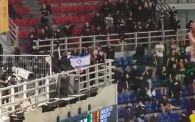 Fans of AEK Athens burn an Israeli flag at a match against Hapoel Jerusalem, in Athens, Greece, April 12, 2023. Twitter