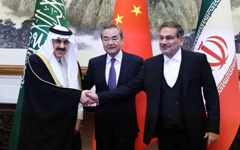 Saudi national security adviser Musaad bin Mohammed Al-Aiban, Chinese Foreign Minister Wang Yi, and Iran's national security adviser Ali Shamkhani meet to finalize the agreement to resume diplomatic ties between Iran and Saudi Arabia in Beijing, China on March 10, 2023. Chinese Foreign Ministry
