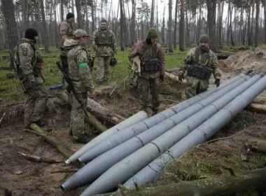 Ukrainian soldiers examine Russian multiple missiles abandoned by Russian troops, in the village of Berezivka, Ukraine. / PHOTO: AP