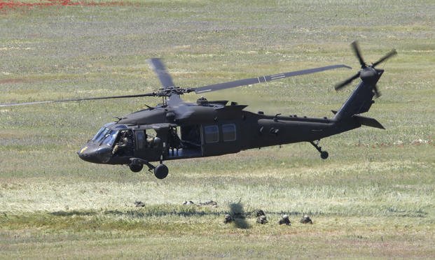 A U.S. Black Hawk helicopter takes off after deploying soldiers during the Swift Response 22 military exercise, May 12, 2022. (AP Photo/Boris Grdanoski, File)
