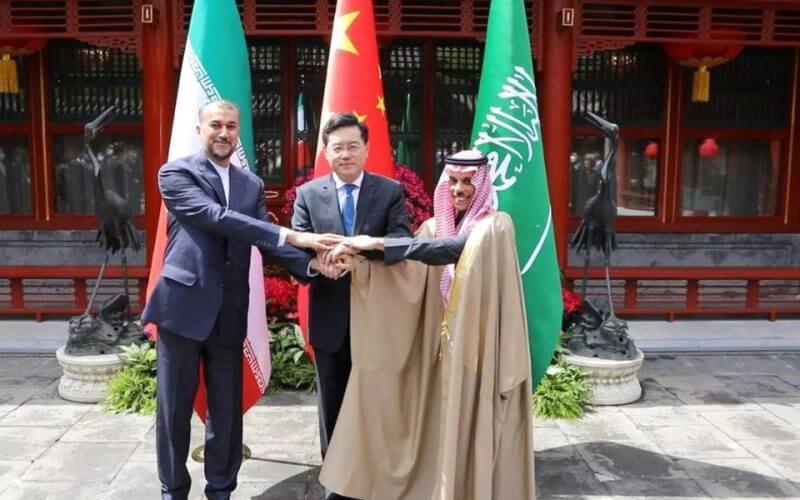 Iranian Foreign Minister Hossein Amir-Abdollahian and Saudi Arabia's Foreign Minister Prince Faisal bin Farhan Al Saud and Chinese Foreign Minister Qin Gang shake hands during a meeting in Beijing, China, April 6, 2023. Iran's Foreign Ministry/WANA (West Asia News Agency)/Handout via REUTERS