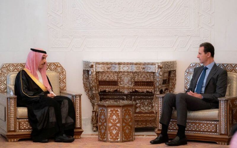 Syria's President Bashar al-Assad meets with Saudi Foreign Minister Prince Faisal bin Farhan, in Damascus, Syria, in this handout released by SANA on April 18, 2023. SANA/Handout via REUTERS