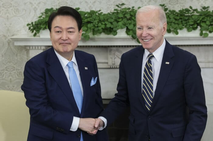 South Korean President Yoon Suk-yeol (L) and President Joe Biden shake hands inside the Oval Office during Yoon's official state visit in Washington on April 26, 2023. Photo by Oliver Contreras/UPI