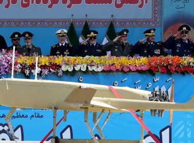 Iranian President Ebrahim Raisi, left, watches combat drones alongside high-ranking officials and commanders during a military parade marking the country's annual Army day in Tehran on April 18, 2023. (Atta Kenare/AFP via Getty Images)