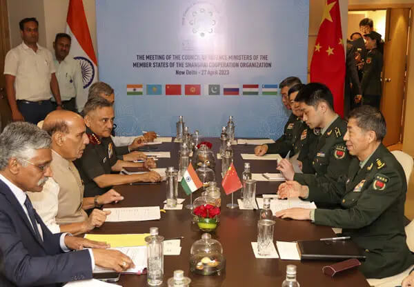 In this photo provided by the Indian Defence Ministry, Indian Defence Minister Rajnath Singh, seated third left, attends a meeting with his Chinese counterpart Li Shangfu, right, during the Shanghai Cooperation Organization Defence Minister's Meeting in New Delhi, India, Thursday, April 27, 2023. (Indian Defence Ministry via AP)