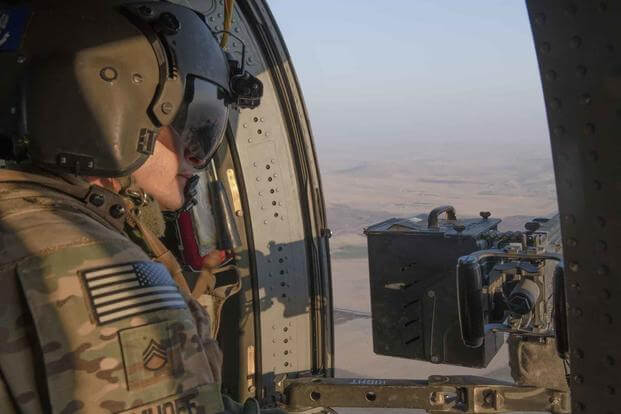 A UH-60 Blackhawk crew chief flies over the Syrian countryside, August 17, 2019. (U.S. Army photo by Spc. Alec Dionne)