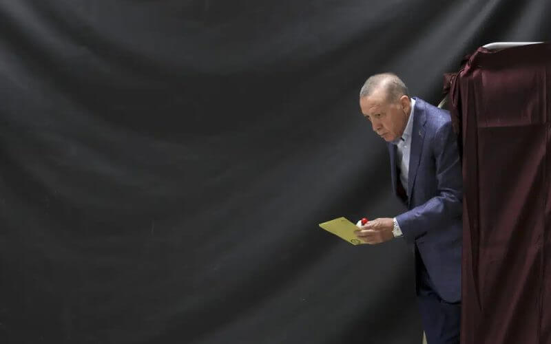 Turkish President Recep Tayyip Erdogan walks out of a voting booth at a polling station in Istanbul, Sunday, May 14, 2023. (Umit Bektas/Pool Photo via AP)