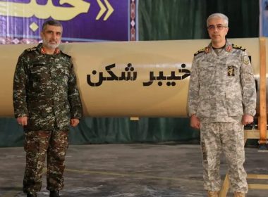 Iranian Armed Forces Chief of Staff Major General Mohammad Bagheri and IRGC Aerospace Force Commander Amir Ali Hajizadeh stand together during the unveiling of a Kheibar Sheka missile at an undisclosed location in Iran Feb. 9, 2022. (West Asia News Agency/Handout via REUTERS )