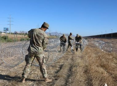 Texas National Guard engineers reinforce razor wire barriers along the Texas-Mexico border near El Paso. Texas Military Department
