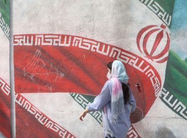 An Iranian woman walks in a street in Tehran, Iran, April 9, 2023. Majid Asgaripour/WANA (West Asia News Agency) via REUTERS