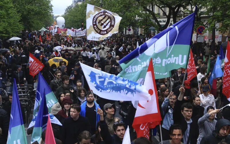 Protesters march during a demonstration, Monday, May 1, 2023 in Paris. AP