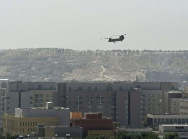A U.S. military helicopter flies above the U.S. embassy in Kabul on Aug. 15, 2021 / Getty Images