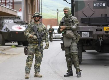 German KFOR soldiers guard municipal building after yesterday's clashes between ethnic Serbs and troops from the NATO-led KFOR peacekeeping force, in the town of Zvecan, northern Kosovo, Tuesday, May 30, 2023. (AP Photo/Bojan Slavkovic)