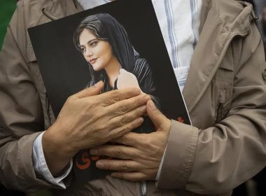 A portrait of Mahsa Amini is held during a rally calling for regime change in Iran following the death of Amini, a young woman who died after being arrested in Tehran by Iran's notorious "morality police," in Washington, on Oct. 1, 2022. (AP Photo/Cliff Owen, File)