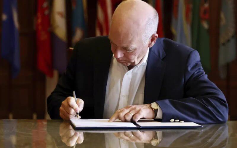 In this photo provided by the Montana Governor's Office, Republican Gov. Greg Gianforte signs a law banning TikTok in the state, May 17, 2023, in Helena, Mont. (Garrett Turner/Montana Governor's Office via AP, File)