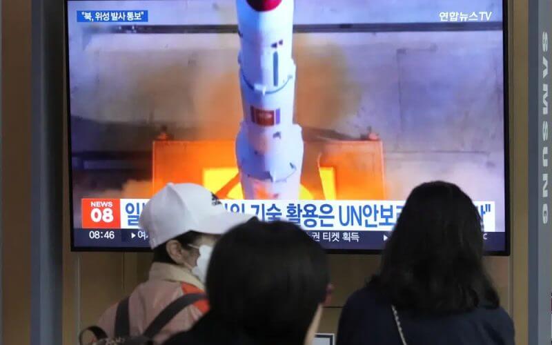A TV screen shows a file image of North Korea's rocket launch during a news program at the Seoul Railway Station in Seoul, South Korea, Monday, May 29, 2023. (AP Photo/Ahn Young-joon)