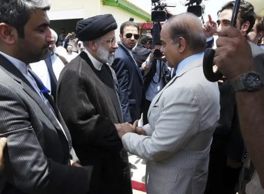 In this photo released by Pakistan Prime Minister's Office, Pakistan's Prime Minister Shahbaz Sharif, right, shakes hand with Iran's President Ebrahim Raisi during an inauguration of the Mand-Pishin border in Pishin, border of Pakistan-Iran, Thursday, May 18, 2023. (Pakistan Prime Minister Office via AP)
