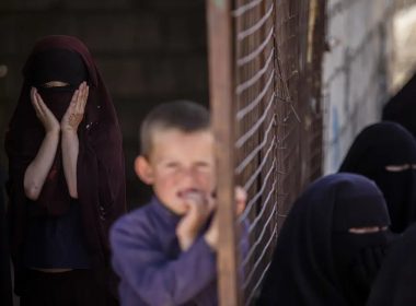 Children stand in al-Hol camp, which houses families of members of the Islamic State group in Hasakeh province, Syria, Wednesday, April 19, 2023. (AP Photo/Baderkhan Ahmad)