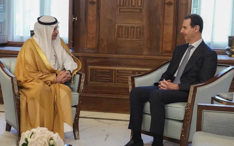 In this photo released by the official Facebook page of the Syrian Presidency, Syrian President Bashar Assad, right, meets with Saudi Arabia ambassador to Jordan Nayef al-Sadiri, in Damascus, Syria, Wednesday, May 11, 2023. (Syrian Presidency Facebook page via AP)