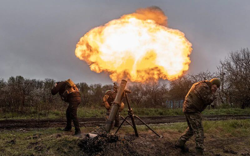 Ukrainian soldiers of the 57th Brigade fire a mortar in the direction of Bakhmut, in Donetsk Oblast, Ukraine on April 20, 2023. (Diego Herrera Carcedo/Anadolu Agency via Getty Images).
