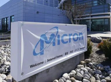 A sign marks the entrance of the Micron Technology automotive chip manufacturing plant on Feb. 11, 2022, in Manassas, Va. (AP Photo/Steve Helber, File)
