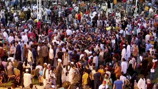 In this screen grab taken from video, Sudanese and foreigners arrive in Port Sudan, the country's main seaport, as they wait to be evacuated out of Sudan, Saturday April 29, 2023. AP