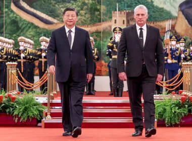 In this photo released by China's Xinhua News Agency, Chinese President Xi Jinping, left, and Cuba's President Miguel Diaz-Canel Bermudez walk during a welcome ceremony at the Great Hall of the People in Beijing, Nov. 25, 2022. AP