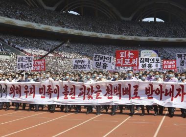 Pyongyang people take part in a demonstration after a mass rally to mark what North Korea calls "the day of struggle against U.S. imperialism" at the May Day Stadium in Pyongyang, North Korea Sunday, June 25, 2023. (AP Photo/Jon Chol Jin)