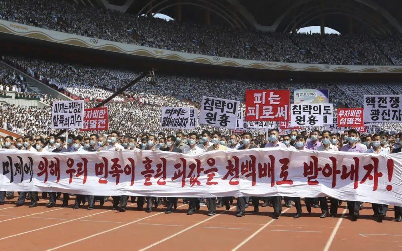 Pyongyang people take part in a demonstration after a mass rally to mark what North Korea calls "the day of struggle against U.S. imperialism" at the May Day Stadium in Pyongyang, North Korea Sunday, June 25, 2023. (AP Photo/Jon Chol Jin)