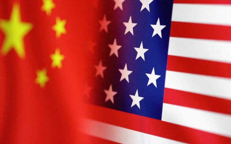 U.S. and Chinese flags are seen in this illustration taken, January 30, 2023. REUTERS/Dado Ruvic/Illustration/File Photo