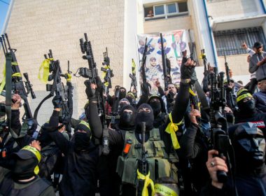 Palestinian gunmen from the Balata Brigade of the Fatah movement's Lions' Den groups carry their weapons during a festival in the Askar refugee camp in the West Bank, December 9, 2022. (photo credit: NASSER ISHTAYEH/FLASH90)
