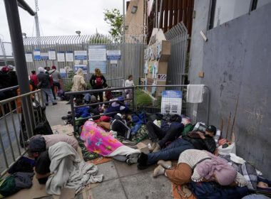 People waiting to apply for asylum camp near the pedestrian entrance to the San Isidro Port of Entry, linking Tijuana, Mexico with San Diego, Thursday, June 1, 2023, in Tijuana, Mexico. U.S. authorities raised the number of people allowed to enter the country with an online app that allows asylum-seekers to enter the country with appointments to 1,250 a day from 1,000 though demand still far outstrips supply. Gregory Bull | AP