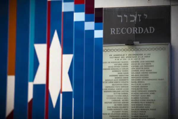 A plaque with the word in Spanish "Remember" and the names of the victims of the 1994 terrorist attack on the the Jewish community center AMIA is placed inside the AMIA compound in Buenos Aires, Argentina, Feb. 8, 2013. (AP Photo/Victor R. Caivano, File)