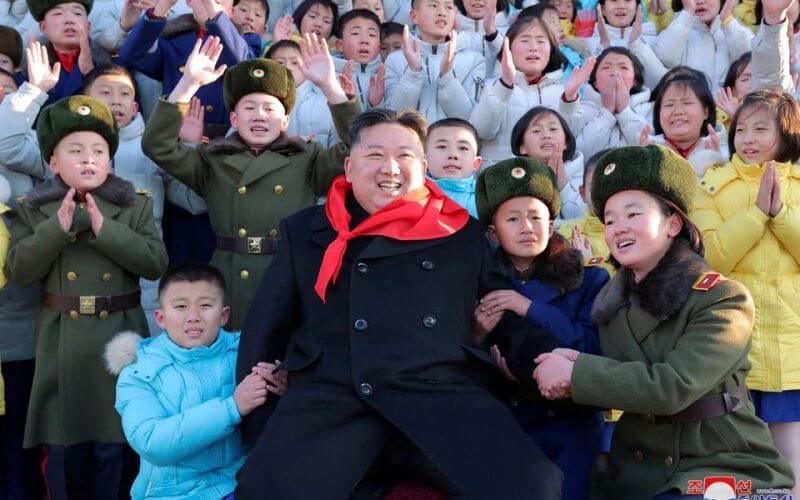 North Korean leader Kim Jong Un poses for a group photo with representatives of the Korean Children's Union (KCU) under North Korea's ruling Workers' Party in Pyongyang, North Korea, in this photo released on January 1, 2023 by North Korea's Korean Central News Agency (KCNA). KCNA via REUTERS